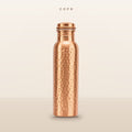 COPR hand-hammered copper water bottle, 34 oz, on a warm cream background