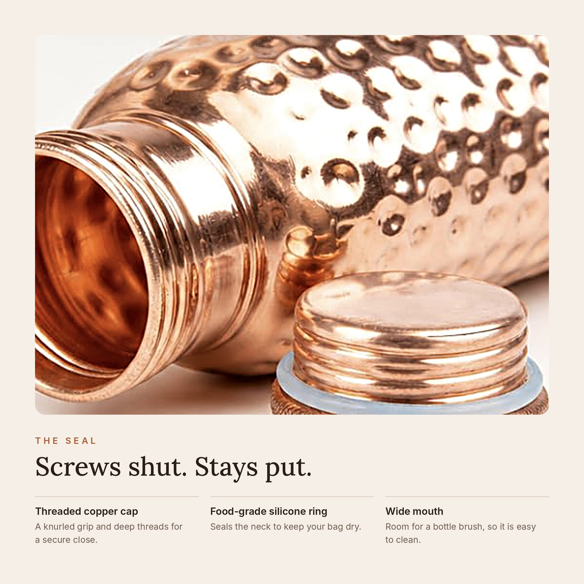 Close-up of the copper bottle's threaded cap with food-grade silicone seal and wide mouth